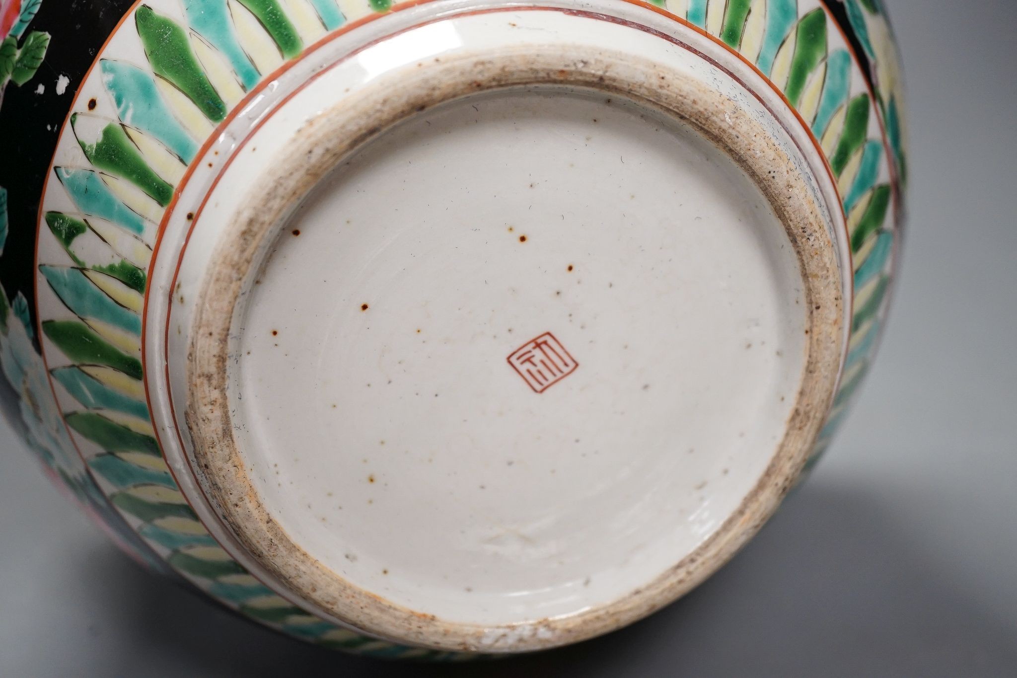 Three late 19th century Japanese porcelain dishes and a jardiniere, 19 cms high.